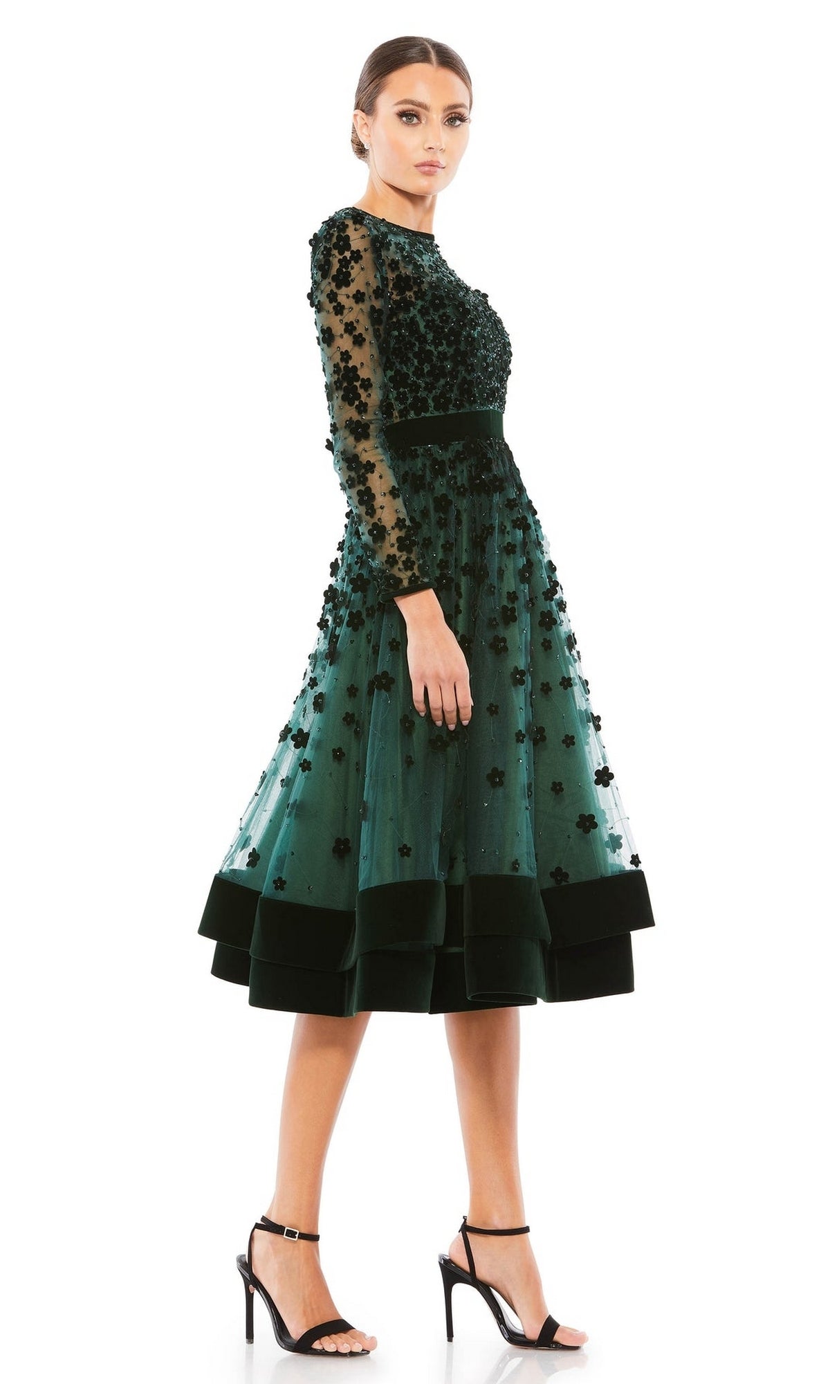 A woman in the Mac Duggal 67007 knee-length wedding-guest dress.